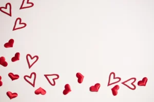 The picture shows red hearts on a white background.