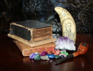 The photo shows the books and ingredients needed to cast a love spell.