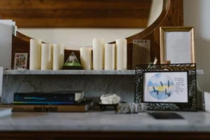 The picture shows candles and books for magic.