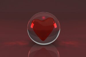 The illustration shows a glass sphere. In the center is placed a heart - a symbol of love.