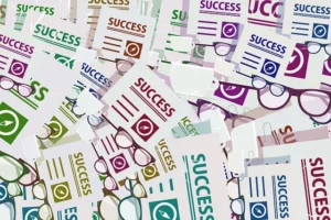 In the picture, we can see the cards with the word “success” on them.