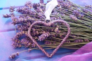 The picture shows a heart - a symbol of love surrounded by lavender.