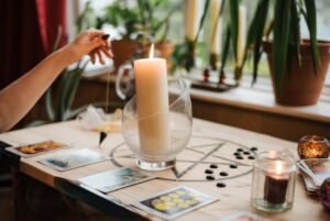 The photo shows the use of a pendulum when casting a love spell.